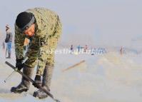 A Worker Dig Ice for the 15th Harbin Ice and Snow World