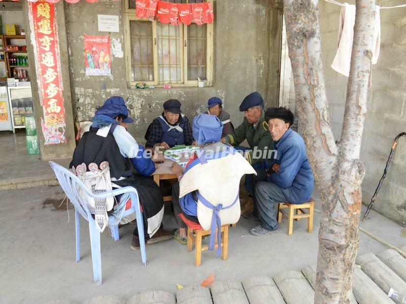 The Old Naxi People Play Mahjong in the Street of Baisha Old Town