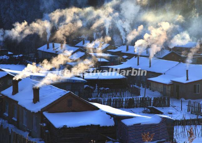 Chimney Smoke Rose from the Cottages in China's Snow Town