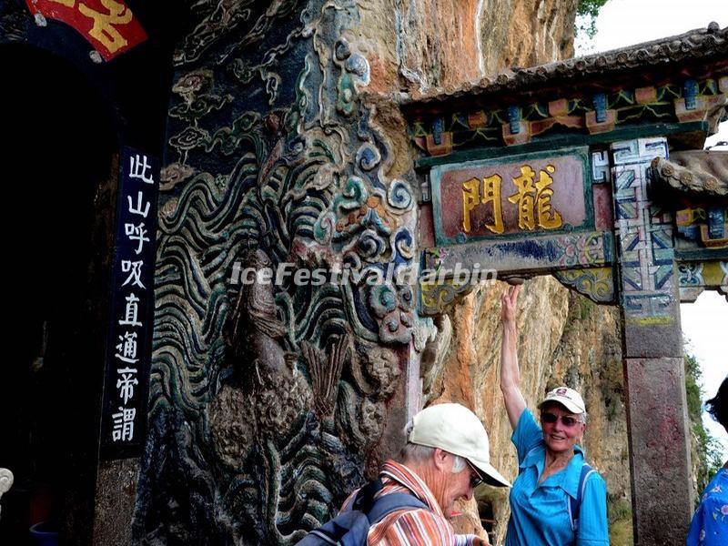 Tourists at the Dragon Gate in Western Hills Forest Reserve